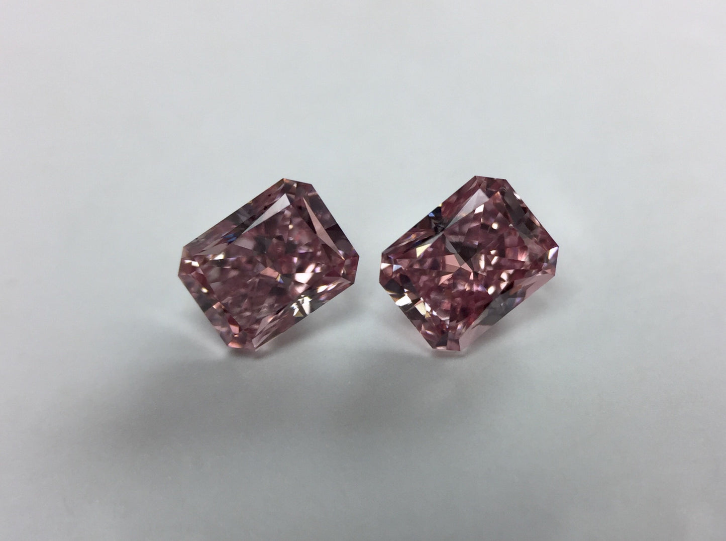 Pair of 0.65ctw Fancy Intense Pink Diamonds, Radiant Shape, VS1/SI2, GIA