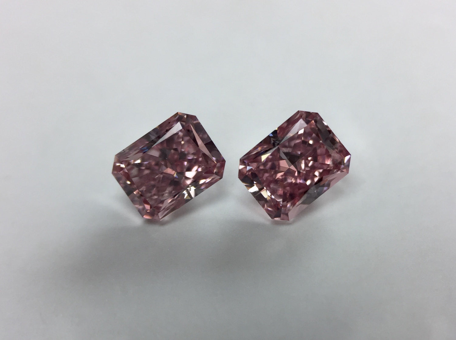 Pair of 0.65ctw Fancy Intense Pink Diamonds, Radiant Shape, VS1/SI2, GIA